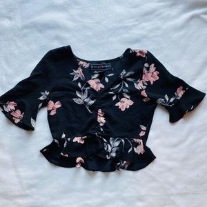 Black floral crop top with bell sleeves